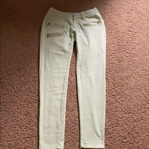 Green jeans with zippers